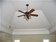 Unique ceiling design and large decorative trim provides an open and airy feel to this room